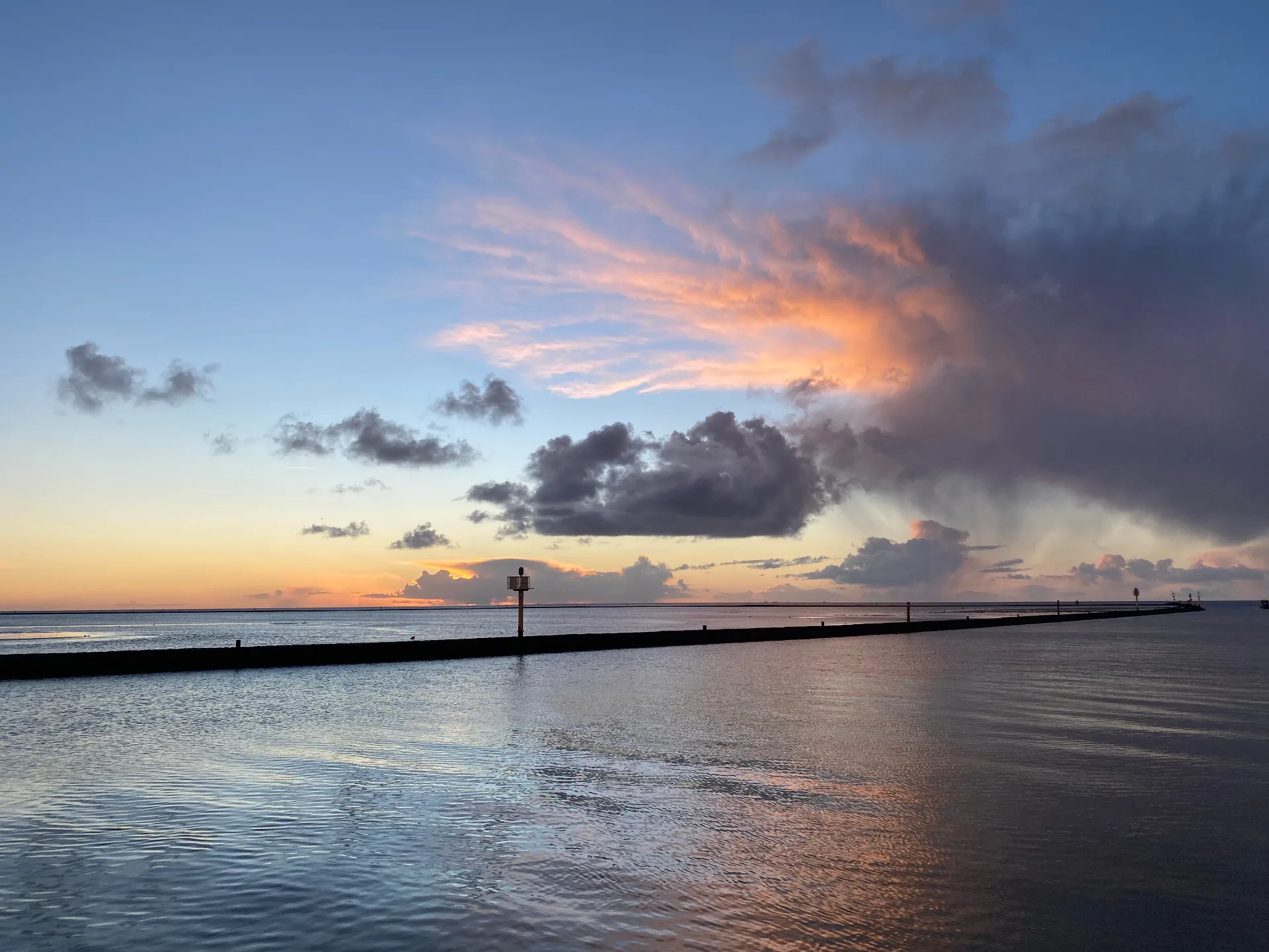 Harbor sunset with pier